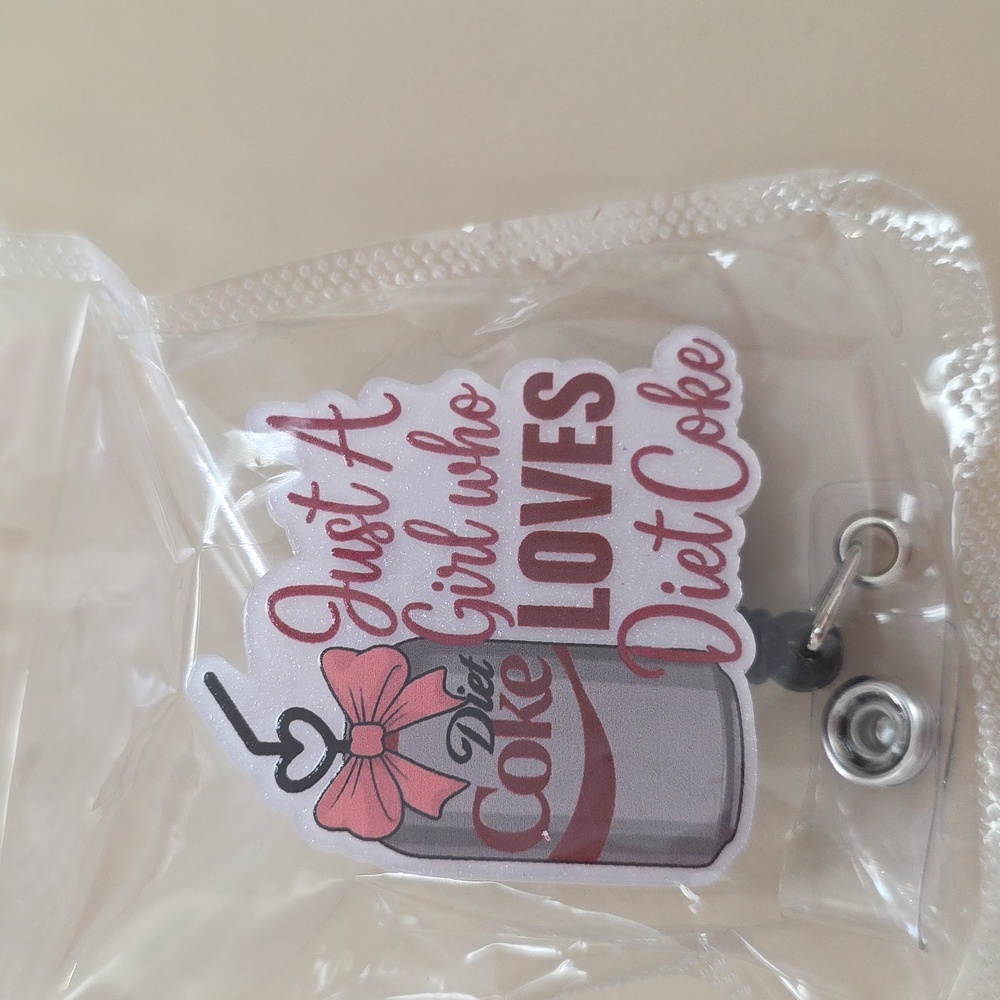 Diet coke badge reel